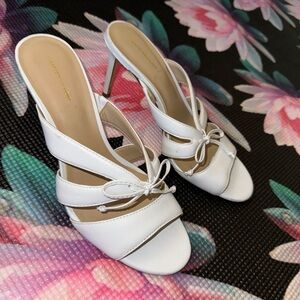 White leather heels with bow detailing